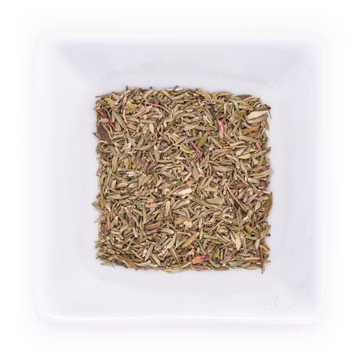A top view of dried rubbed thyme in a white bowl