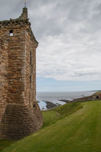 A vertical shot of a detail of the famous historic St Andrews Cathedral under a blue cloudy sky