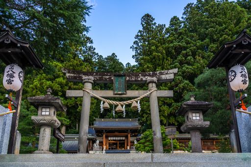 The Sakurayama Hachimangu Shrine surrounded by trees under the sunlight in Takayama in Japan