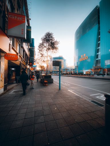 The city street view with modern buildings against a blue sky in Taipei, Taiwan