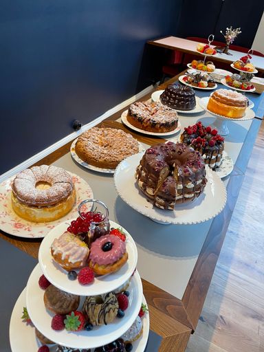 A vertical shot of a fourchette full of sweet cakes ready for serving