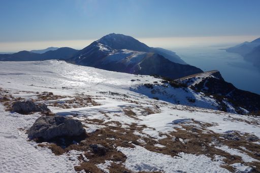 A snowy top of a lofty mountain near the river
