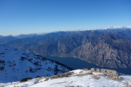 A snowy top of a lofty mountain near the river