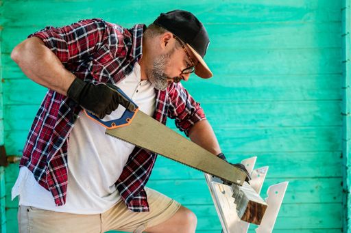 A Caucasian repairman in a workshop