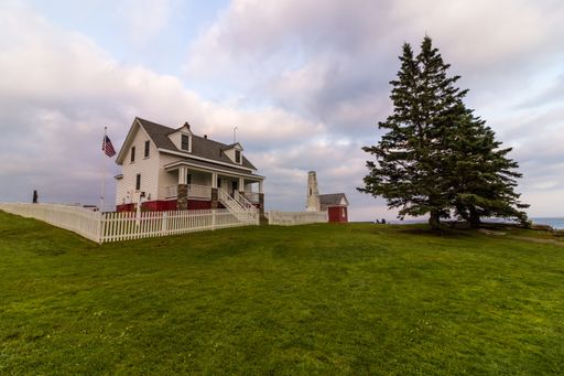 Pemaquid Point Lighthouse in Bristol, Maine, at sunset on a summer evening, coastal Maine tourism