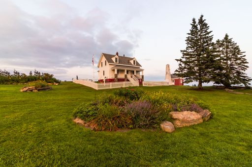 Pemaquid Point Lighthouse in Bristol, Maine, at sunset on a summer evening, coastal Maine tourism