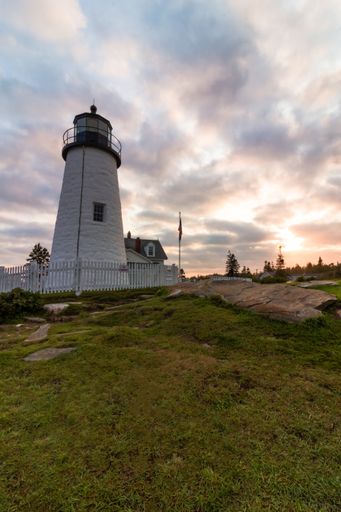 Pemaquid Point Lighthouse in Bristol, Maine, at sunset on a summer evening, coastal Maine tourism