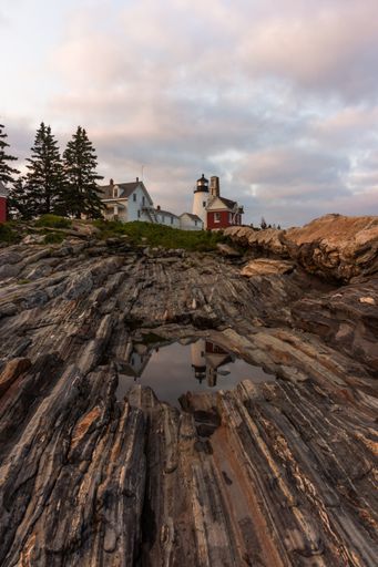 Pemaquid Point Lighthouse in Bristol, Maine, at sunset on a summer evening, coastal Maine tourism