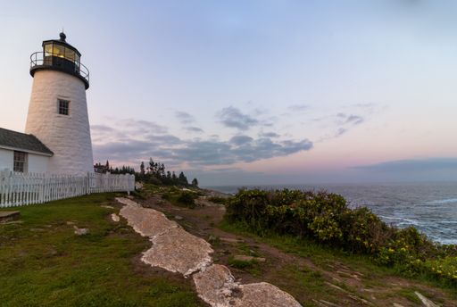 Pemaquid Point Lighthouse in Bristol, Maine, at sunset on a summer evening, coastal Maine tourism