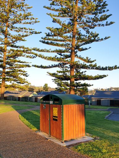 A horizontal shot of bins to collect general waste recycled from tourists in public areas. Kiama NSW Australia