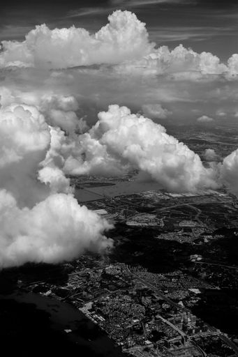 An aerial grayscale shot of a city