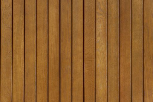 Fence of dark brown wooden planks with matte varnish coating. Wooden texture background.