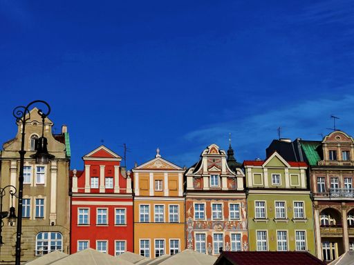 The colorful classic old house in Poznan, Poland against a blue sky