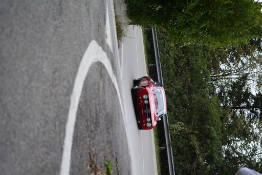 An Alfa Romeo junior gt in the headlight cup uphill race