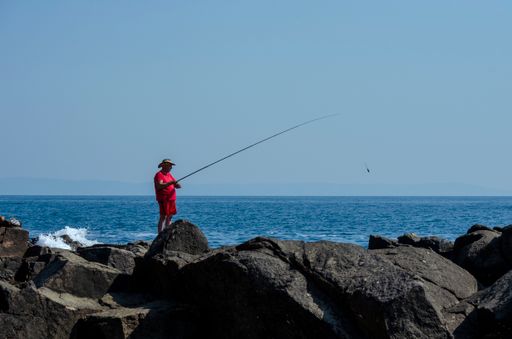 A fisherman tries to catch fish from the Black Sea near Chernomorets town, Bulgaria