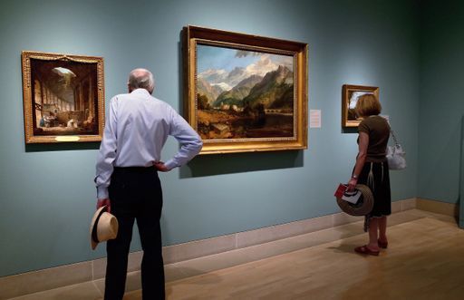 Two people watching paintings in the Dallas Museum of art p gallery, United States