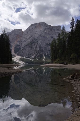 The Pragser Wildsee surrounded with Dolomite mountains in spring