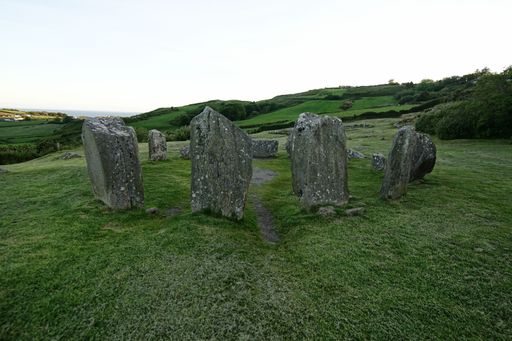 A closeup shot of a beautiful Drombeg Stone Circle in Glandore, Ireland among green nature