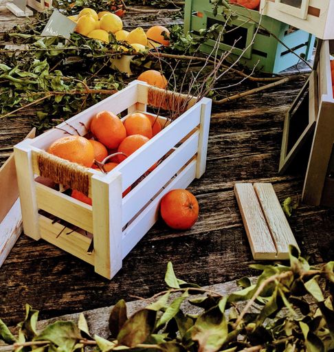 A box of fresh juicy oranges stacked at the food market