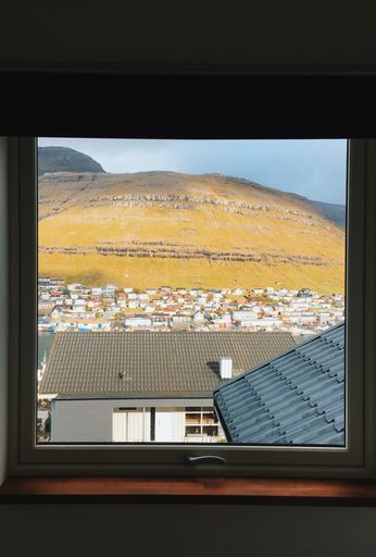A view through the window of a house in Klaksvik, Faroe Islands in the Kingdom of Denmark