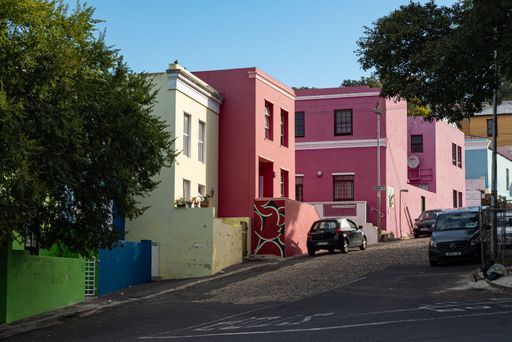 Colorful houses in Bo-Kaap, Cape Town, showcasing vibrant architecture on a sunny day.