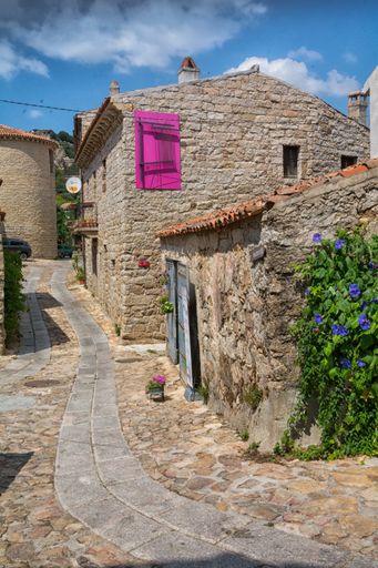A beautiful view of the old traditional residential houses in Aggius town , Italy