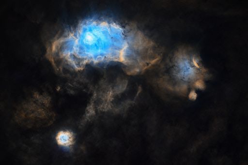 A lagoon nebula on a cloudy sky at night - perfect for wallpapers