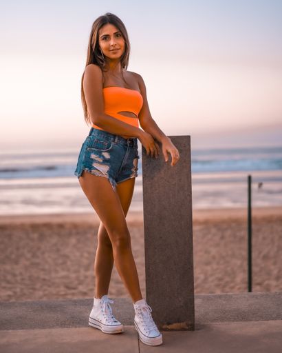 A vertical shot of a beautiful brunette in Zarautz, Spain