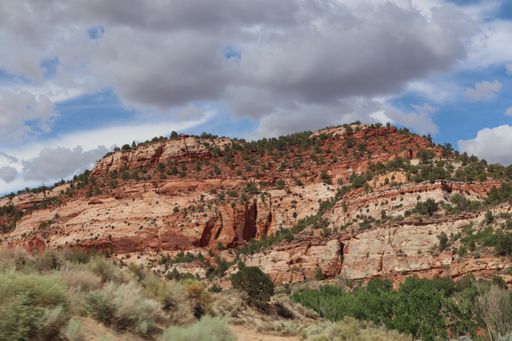 A mesa among rugged layered red rock dramatic desert landscape at the Grand Canyon in Arizona, USA