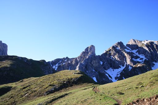 A beautiful shot of tall rocky mountains on a clear sunny day