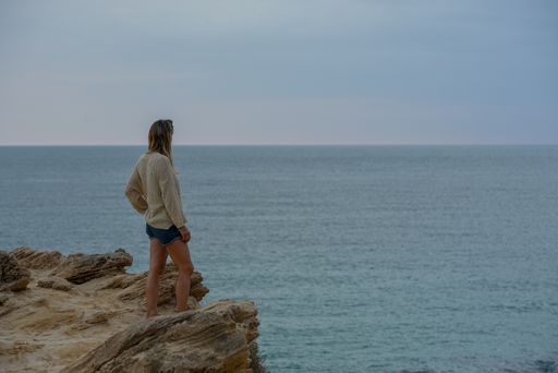 The Young blonde woman in Calo d es Mort on the island of Formentera in Spain in summer 2021.