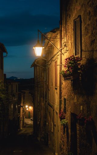 old mediterranean alley at night in acquapendente, italy