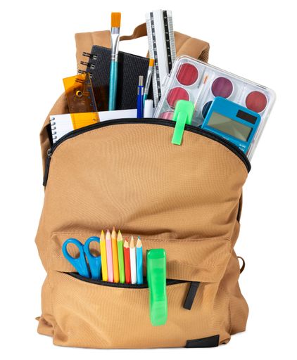 School backpack overflowing with Stationery Supplies isolated on white background, ready for back to school season