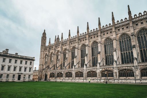Stunning view of King's College Chapel in Cambridge showcasing its Gothic architecture against a cloudy sky.