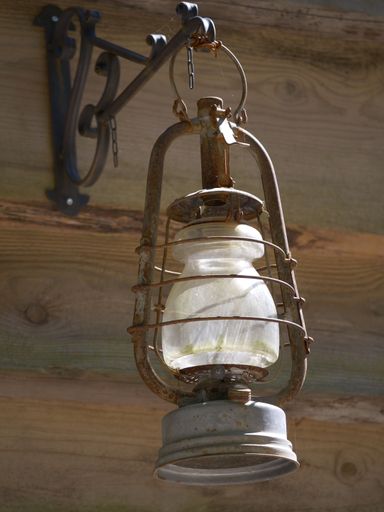 An antique lamp illuminated by sunlight in a close-up view