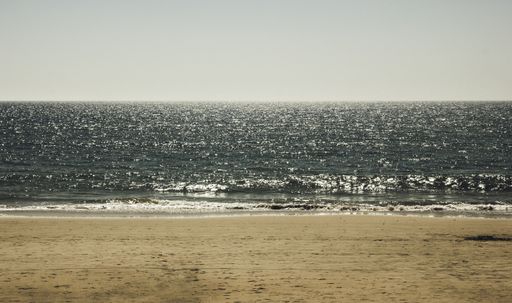 A shot of the seaside on a calm beautiful summer sunny day