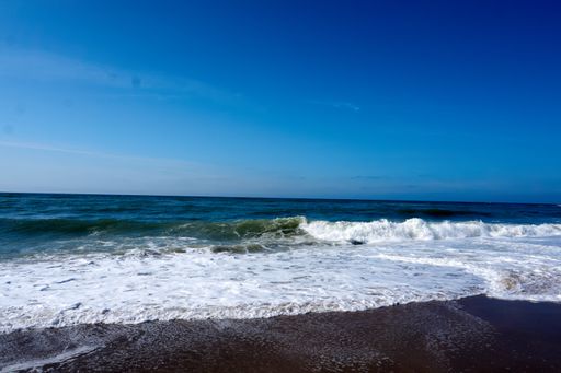 A beautiful view of a beach under the blue sky on a sunny day