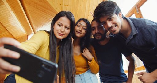 The South Asian young people from India taking selfies
