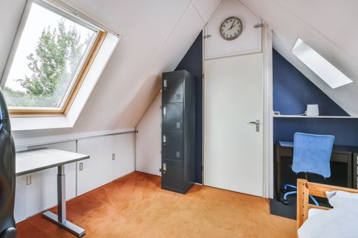 An interior shot of a bedroom with nice furniture under a roof