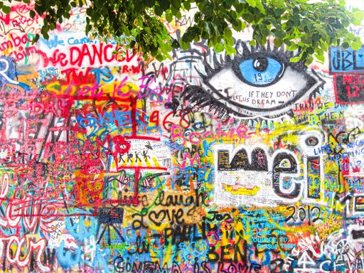 A closeup shot of the Lennon Wall Grafitti in Prague, Czech Republic