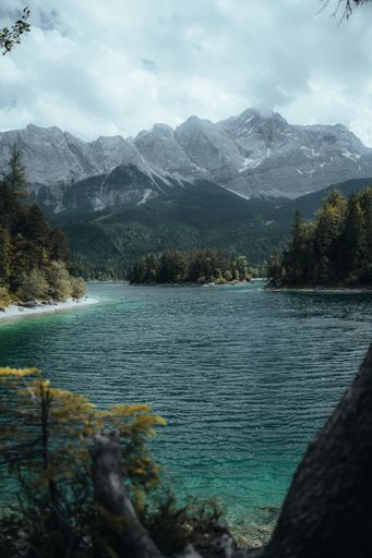 A serene landscape of the azure lake under the highland mountains of Deutschland