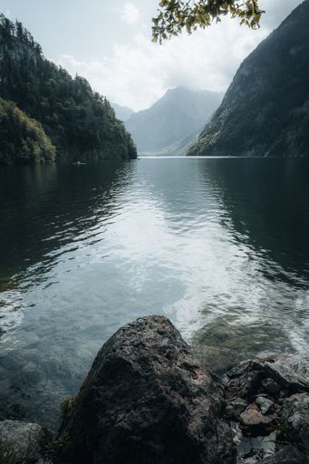 A tranquil scenery of a lake in smog in Berchtesgaden National Park in Germany