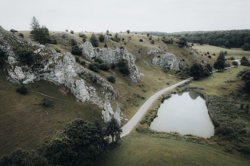 An aerial landscape of a route through a mountain