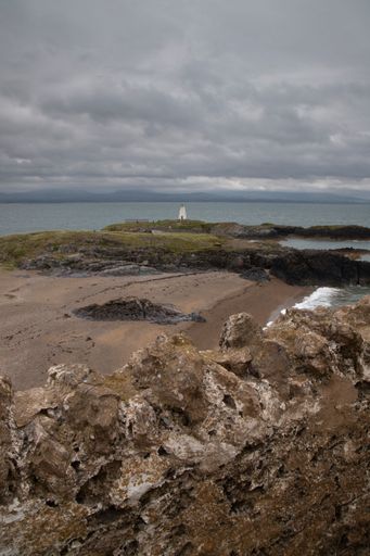 A scenic view of Ynys Llanddwyn on Anglesey, Wales, with picturesque landscapes and natural beauty.