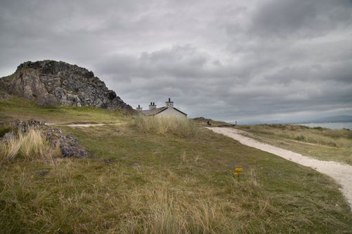 A scenic view of Ynys Llanddwyn on Anglesey, Wales, with picturesque landscapes and natural beauty.