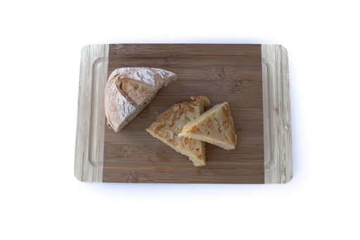 Authentic Spanish potato omelette called tortilla de patatas isolated on white background. Egg omelet