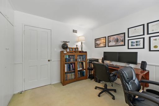 Mid-century style home featuring retro kitchen, wood-paneled living room, cozy bedrooms, and charming vintage bathrooms.