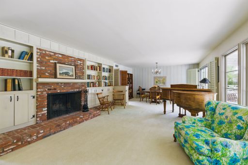 Mid-century style home featuring retro kitchen, wood-paneled living room, cozy bedrooms, and charming vintage bathrooms.