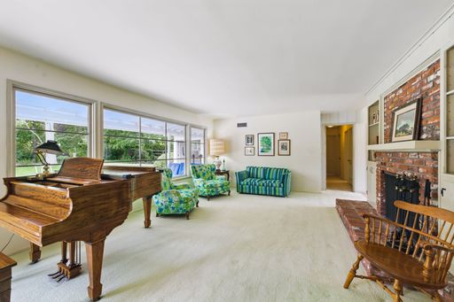 Mid-century style home featuring retro kitchen, wood-paneled living room, cozy bedrooms, and charming vintage bathrooms.