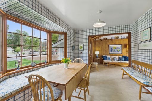 Mid-century style home featuring retro kitchen, wood-paneled living room, cozy bedrooms, and charming vintage bathrooms.